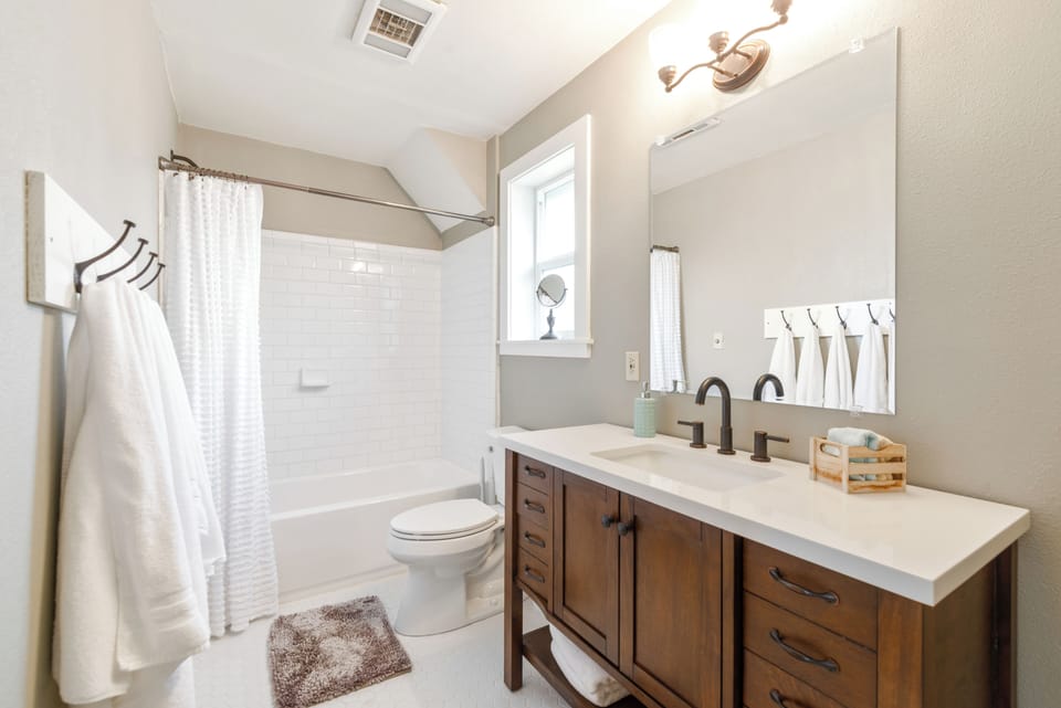 1st-Full Bathroom | Attached to 1st Bedroom (Primary-King) | Plush Towels | Soap | Shampoo-Conditioner | Hair Dryer | Tile Floors & Surround