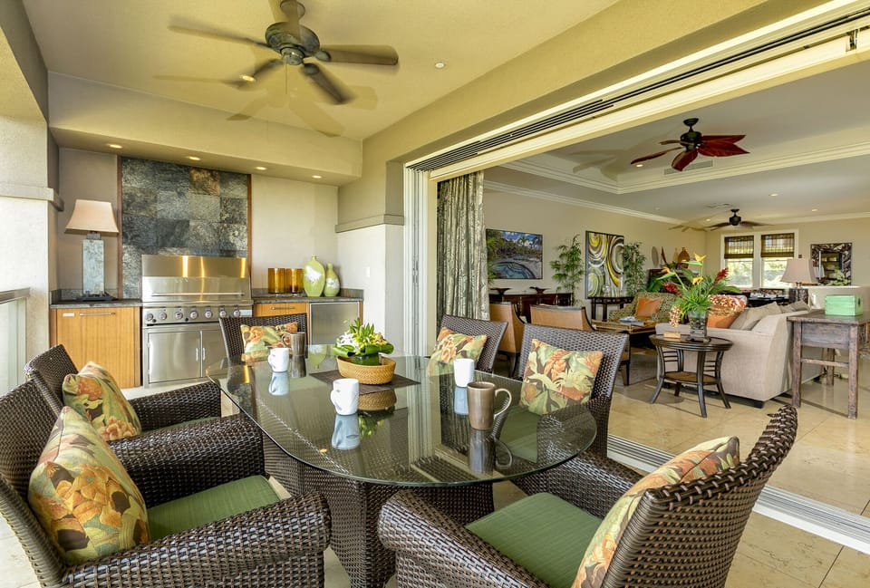 Upper lanai with ocean views, outdoor grill, dining for six and extra seating