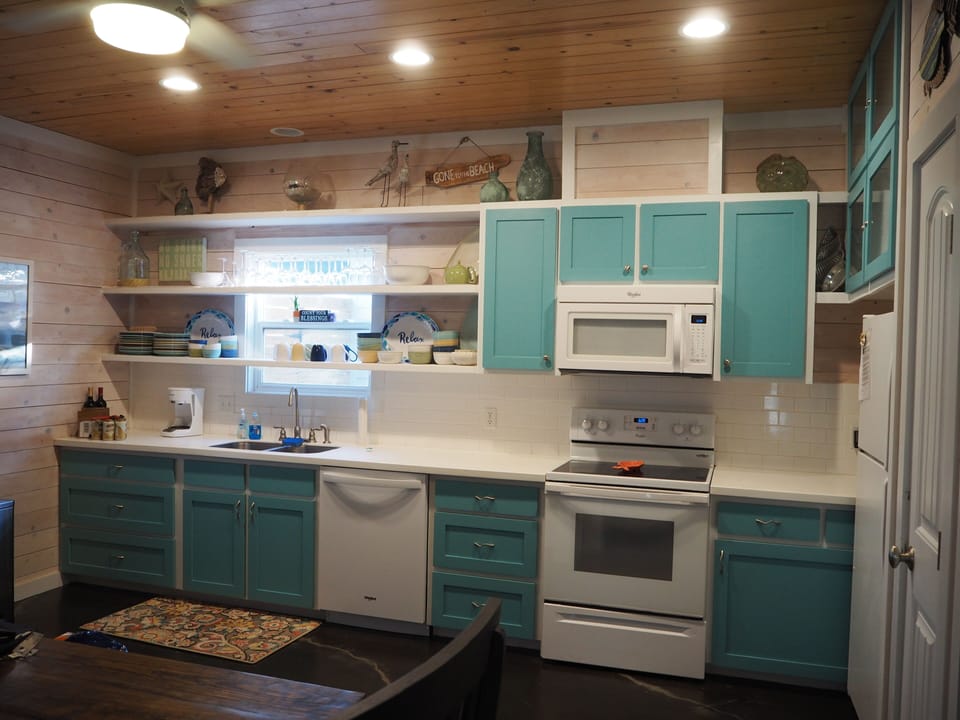 Large fully furnished kitchen with plenty room to cook meals for a crowd.