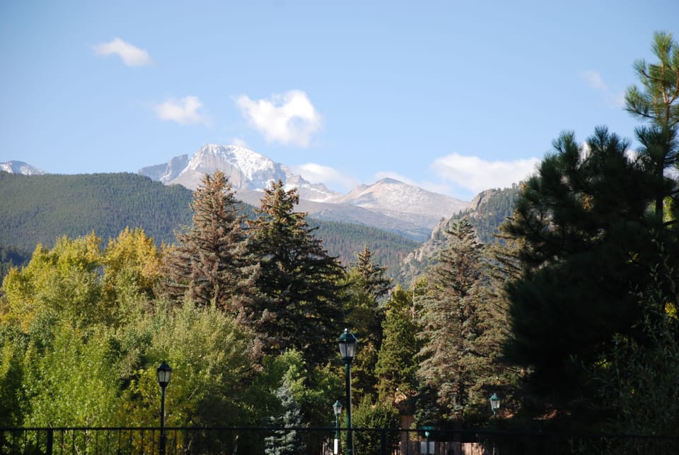 Riverside Cottage is in the trees on right side of Photo. Longs Peak in Bkgd.