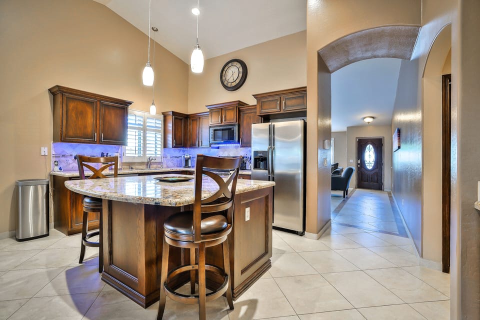 Visit with the cook, while you relax arround the granite island counter. 