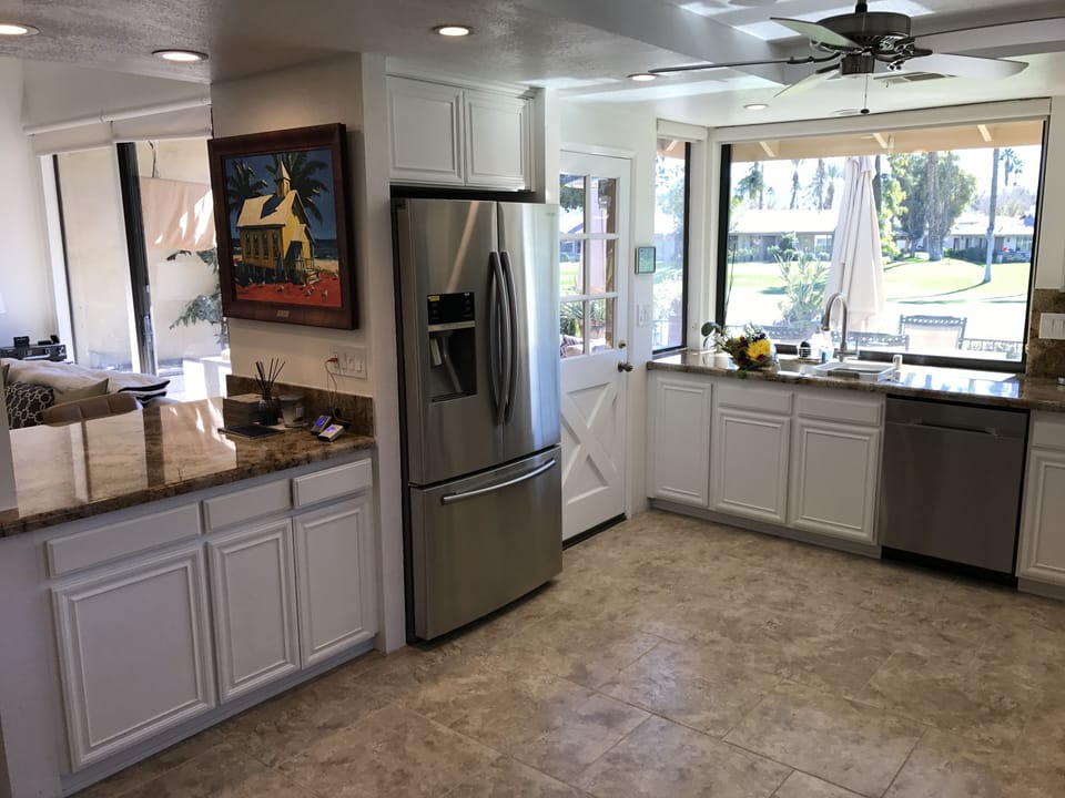 Kitchen has stainless and granite. Stove is gas.