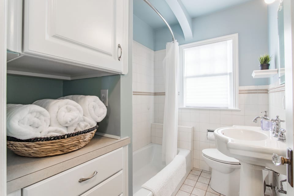 1st-Full Bath on Main Floor | Adjacent to 1st Bed (King)  & 2nd Bed (Queen) on Main Floor | Tub & Shower | Shampoo-Conditioner & Soap | Plush Towels | Hair Dryer 