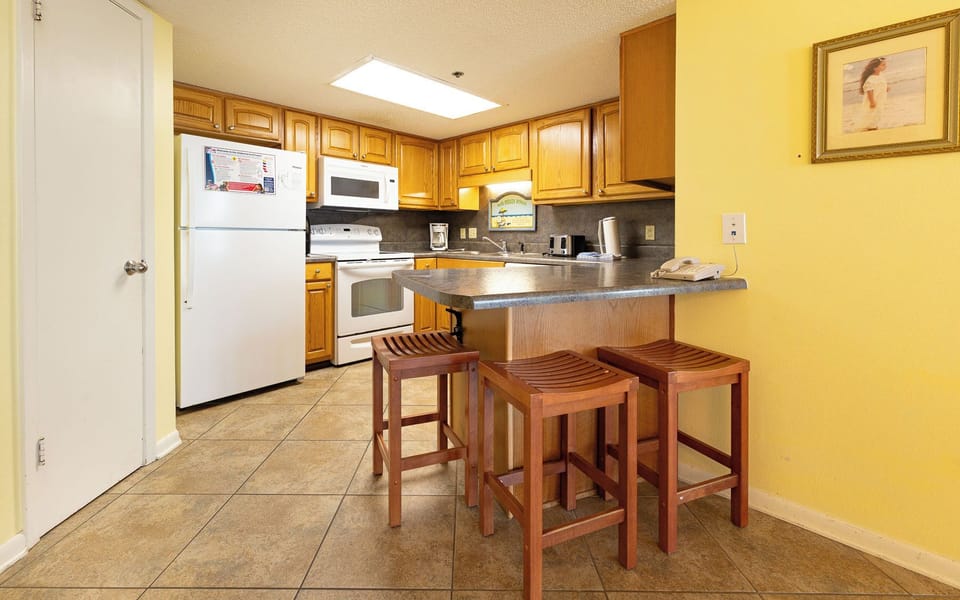 Gather at the breakfast bar with family to snack and chat while dinner plans cook
