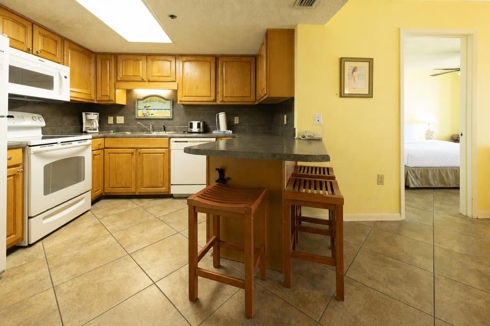 Coffee brewing aroma fills your kitchen as you gather for easy mornings between beach days