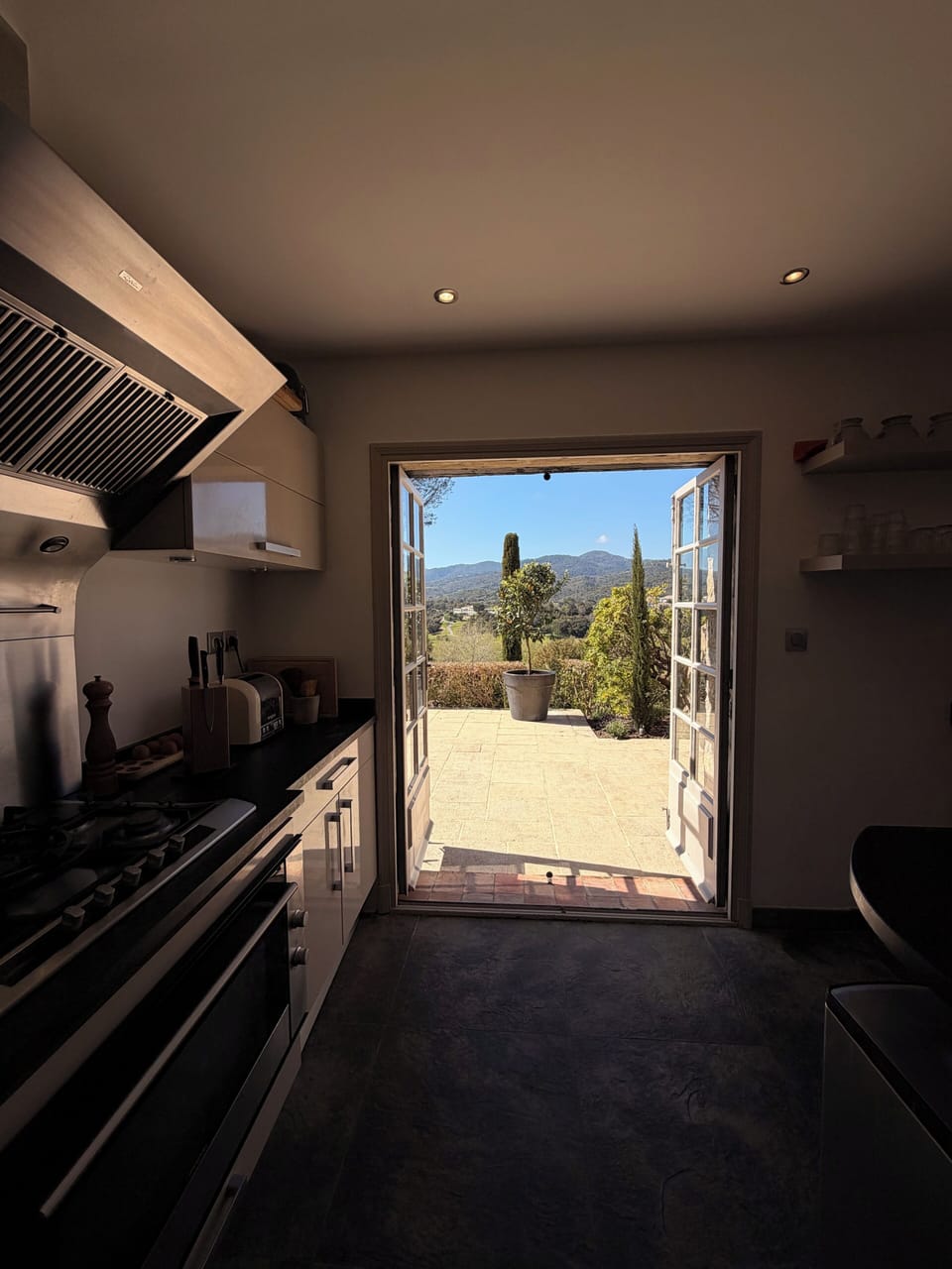 Kitchen towards outdoor dining and terrace.