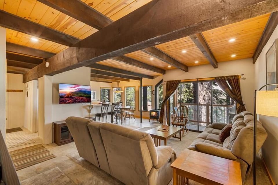 Comfort, warm lighting, fireplace, TV, and views