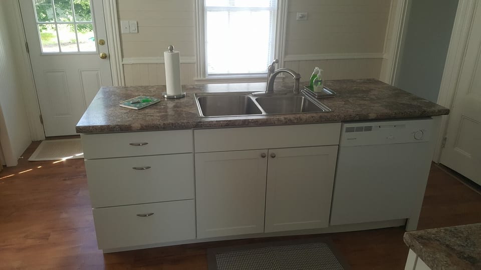 Double bowl sink  and dishwasher.