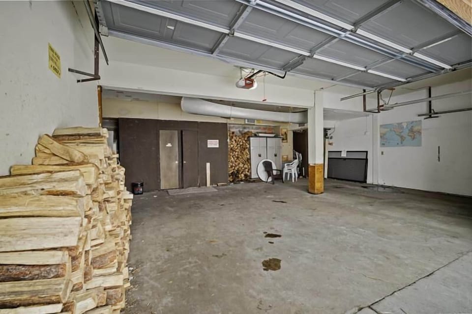Dedicated garage with complimentary firewood