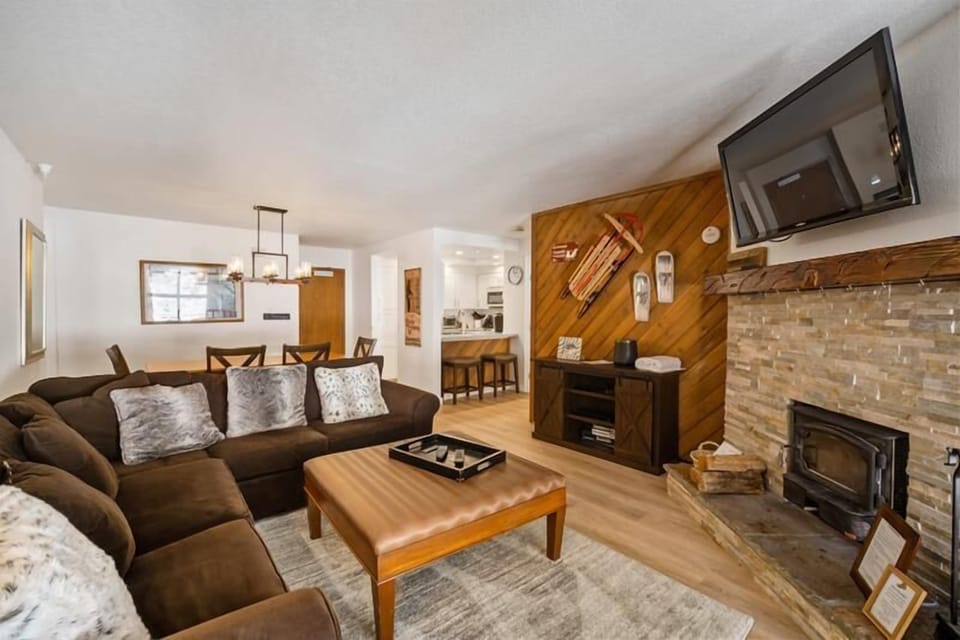 Sectional sofa in front of the fireplace.