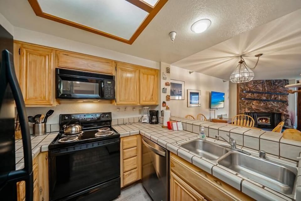 Double sink, counter space, open to living area.