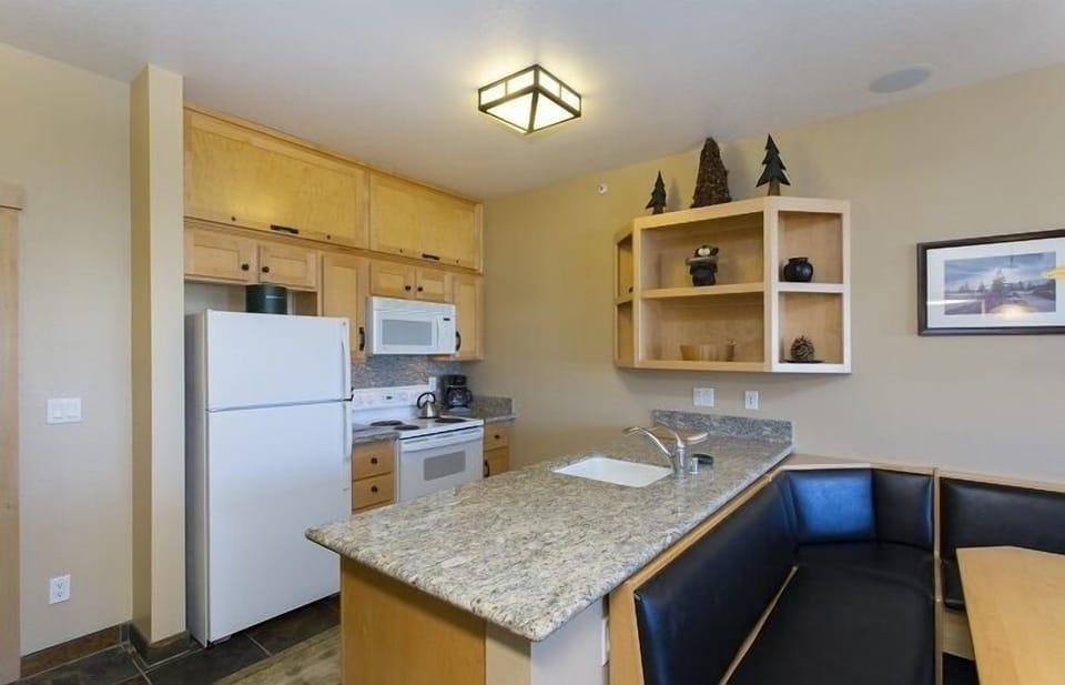 Updated cabinets and white appliances