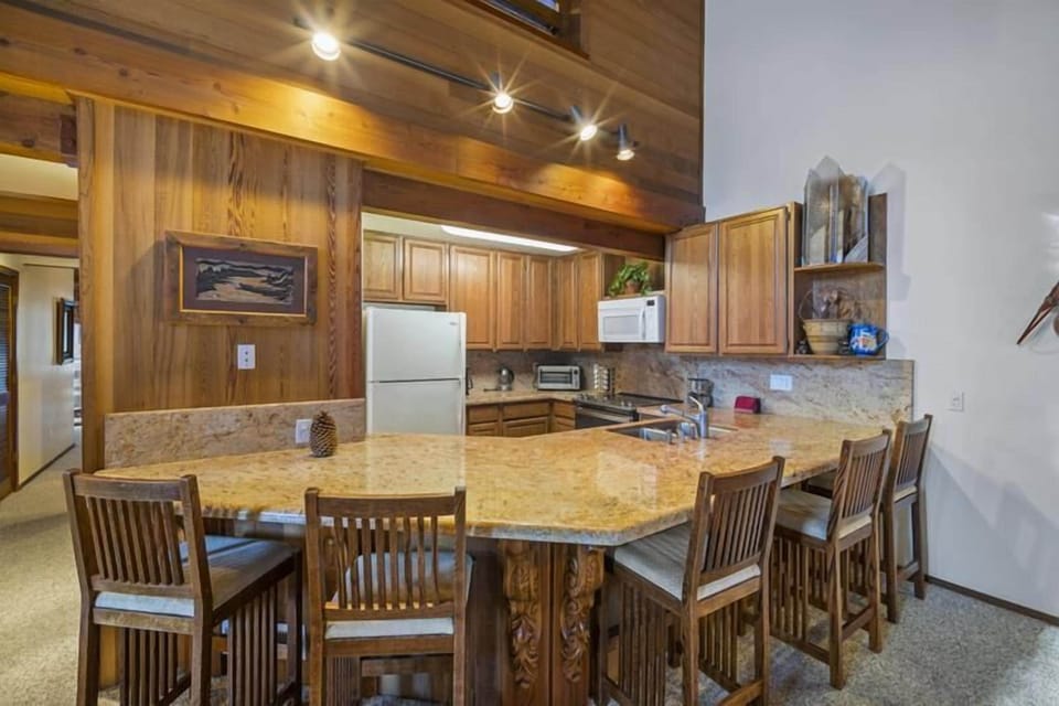 Huge counter space with high bar stool seating