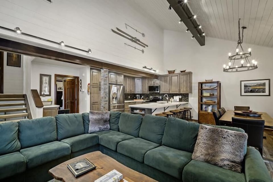 Forest green sectional with vaulted ceilings