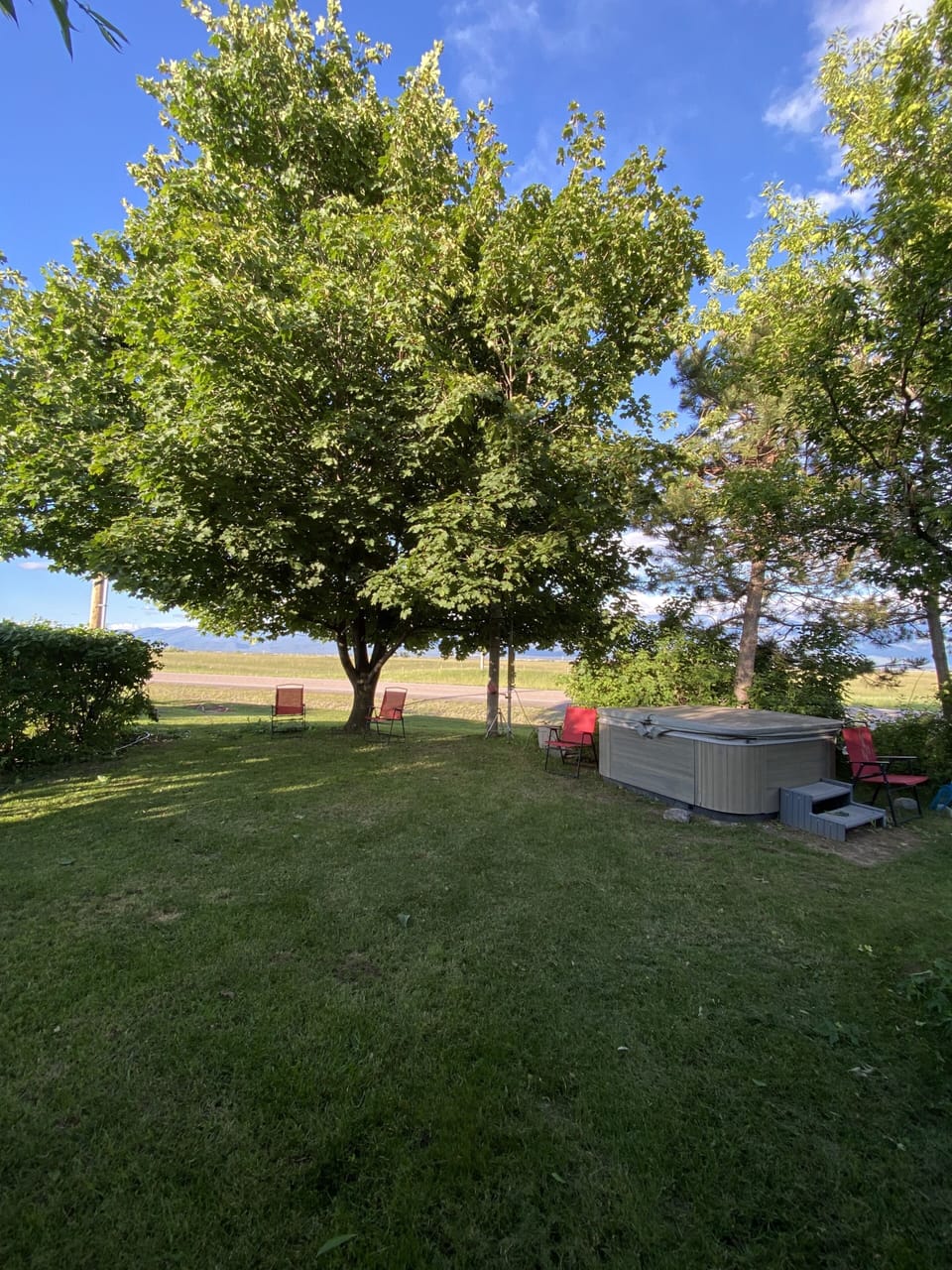 Apartment private yard with hot tub available for use anytime during stay!