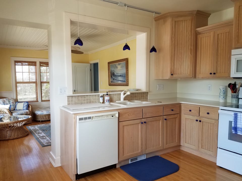 The kitchen is bright, sunny, and fully stocked for cooking that special meal.