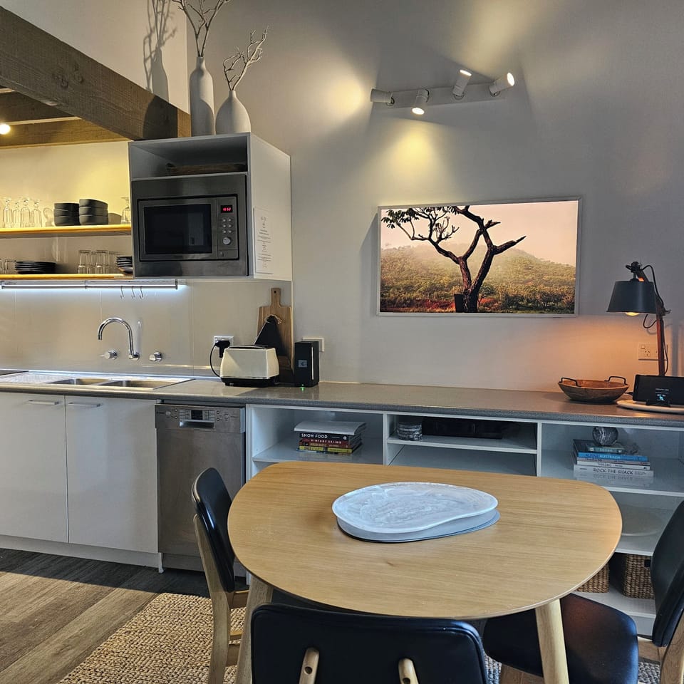 Dining open to kitchen/lounge with new The Frame TV