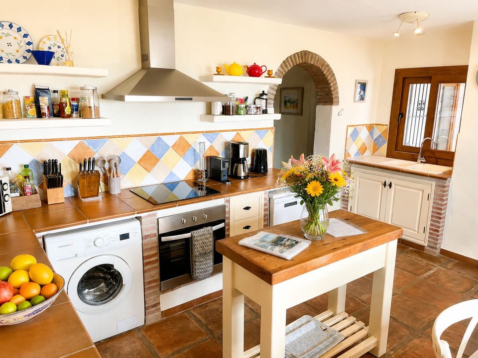 Fully equipped kitchen with dining area.