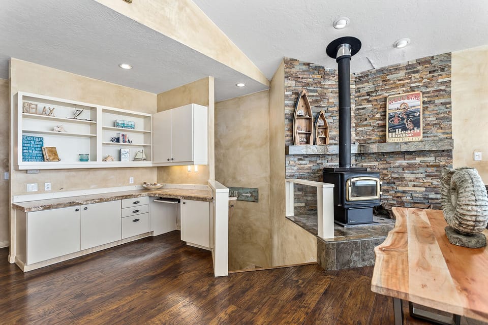 Office area which has a large external computer monitor and cozy desk chair. 