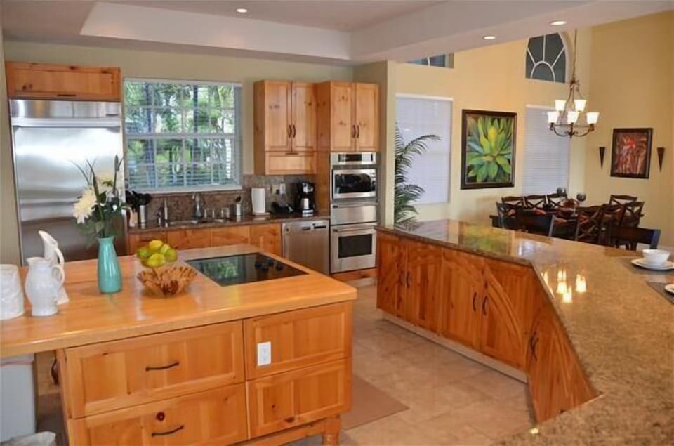 Exceptionally Large Open Kitchen Overlooks Dining, Living & Outdoor Pool Areas...