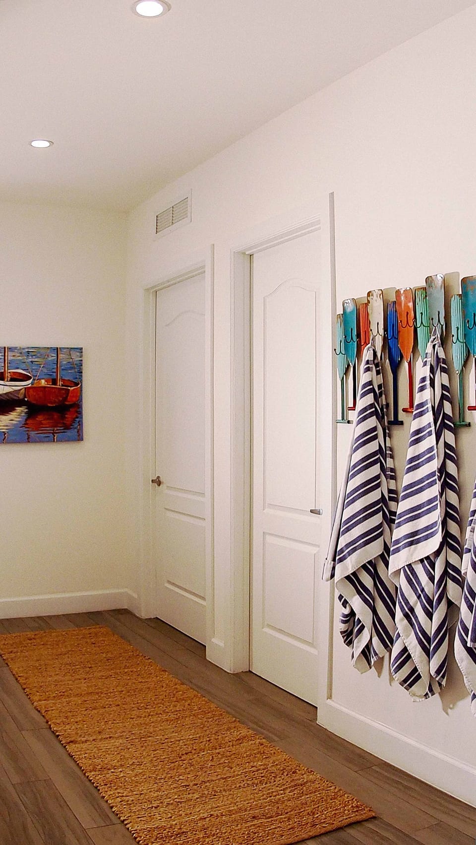 The house has beach towels, toys, chairs and umbrellas, plus cart to  ferry them