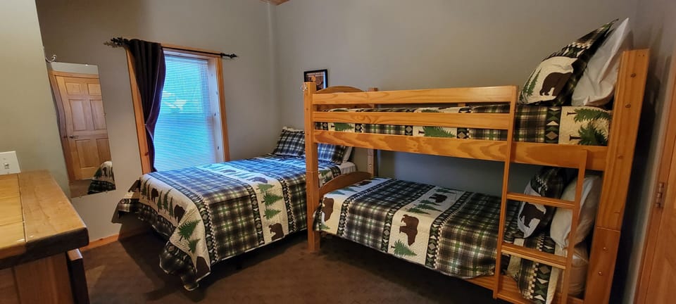 Lower level family suite with queen bed and bunk bed. Attached full bath.