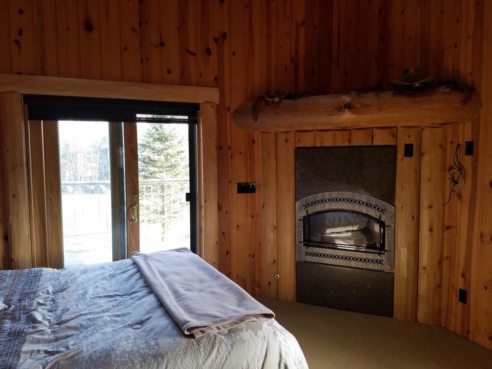 Master bedroom with private porch, gas fireplace, and luxurious shower/wet sauna