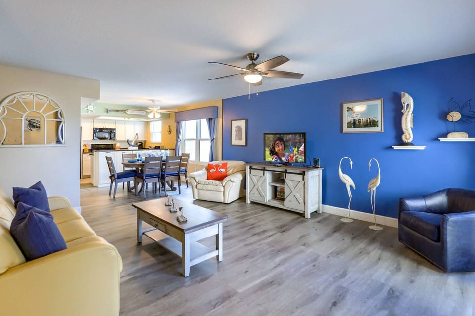 Spacious and Updated Living Room with Leather Sleeper Sofa and Flat Screen Cable TV