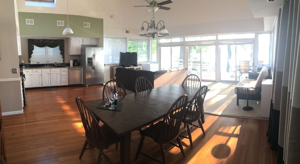 Open floor kitchen, LR, and DR, with panoramic view of lake. 
