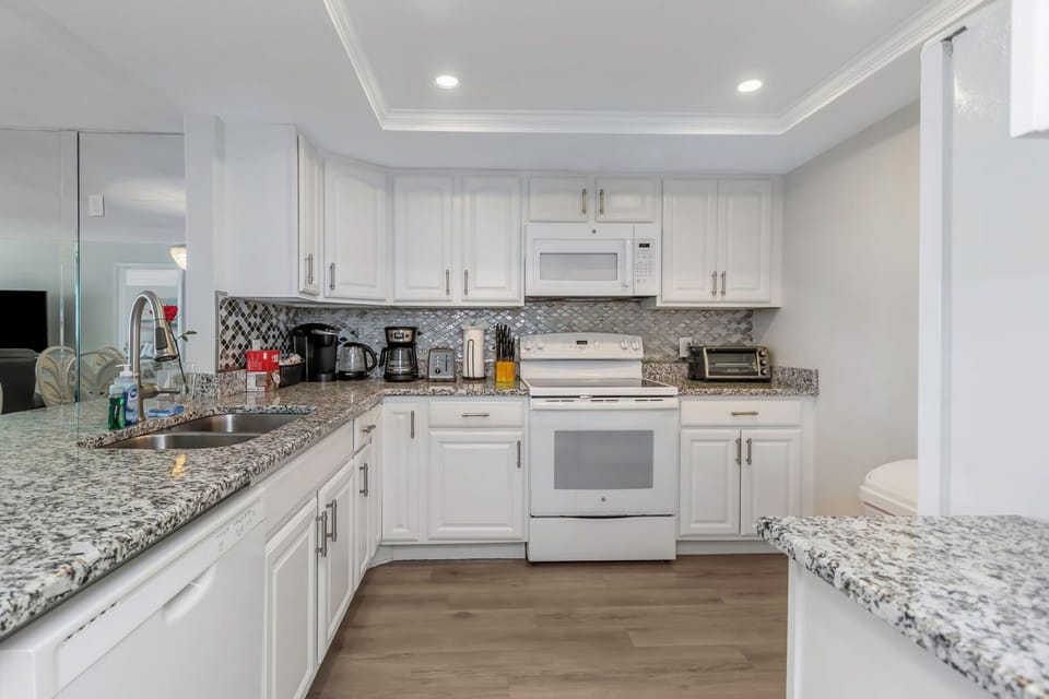 Kitchen has all amenities and well stocked cookware and utensils.