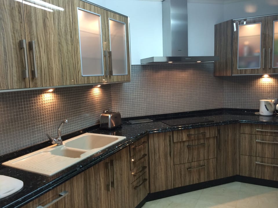 New Designer Fully Fitted Kitchen with Integral Dishwasher and Fridge Freezer.
