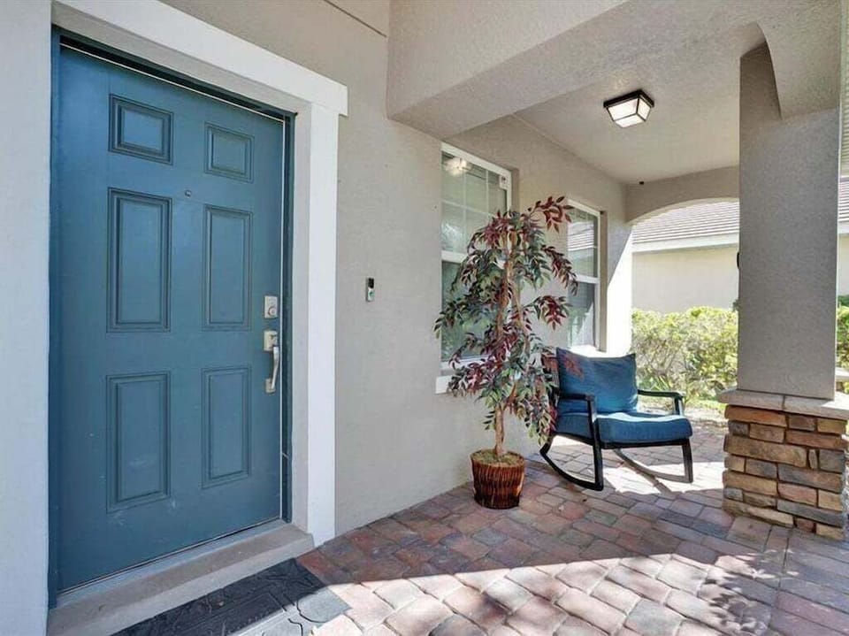 Welcoming front entryway with charming decor and a cozy seating area.
