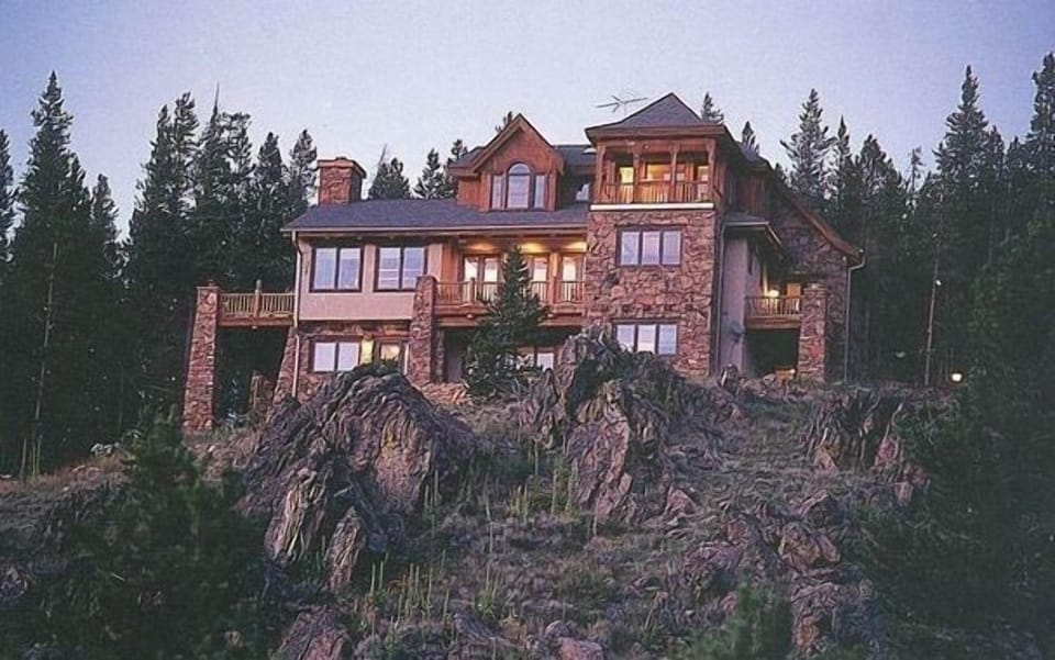 Towers over 30 acre meadow below