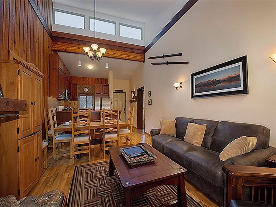 Relax in your cozy mountain retreat with rich wood details and soaring ceilings creating the perfect alpine atmosphere.