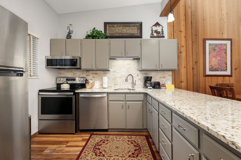 Your fully-equipped kitchen features granite countertops, stainless steel appliances, and everything you need to create memorable meals during your stay.