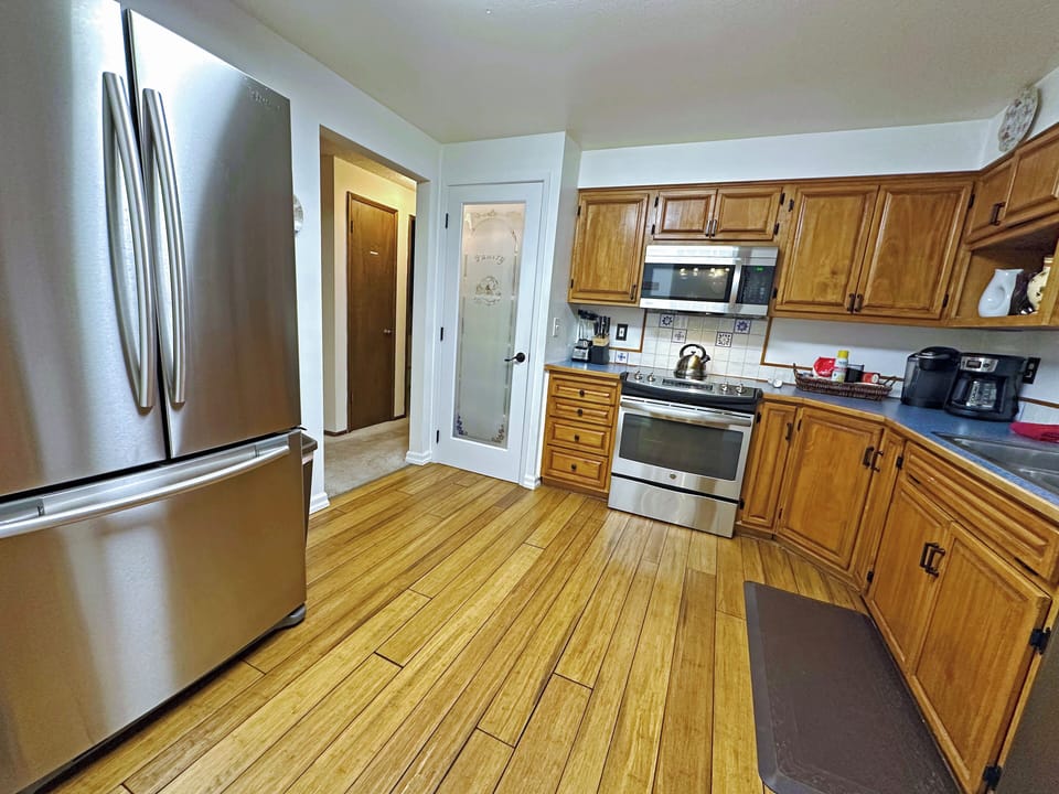 Chef's Kitchen- Pantry, professional range, microwave, French Door refrigerator.