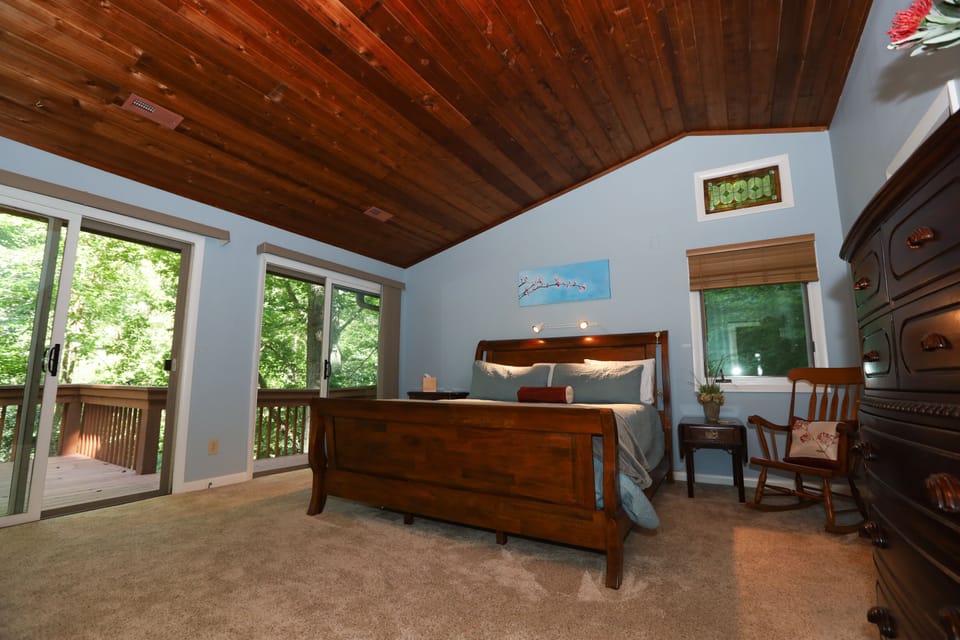 Primary bedroom with king bed and walk out patio doors to the front balcony!