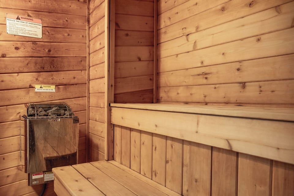 Unwind in the clubhouse sauna where warm cedar surrounds you and gentle heat melts away stress.