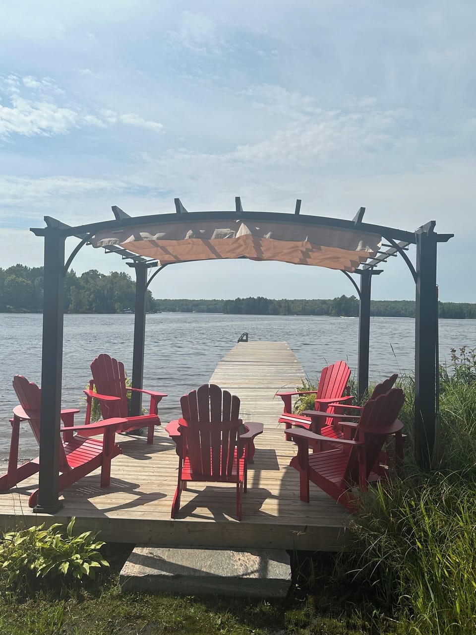 Shallow sandy beach, gentle entry, and long dock for deep water too.