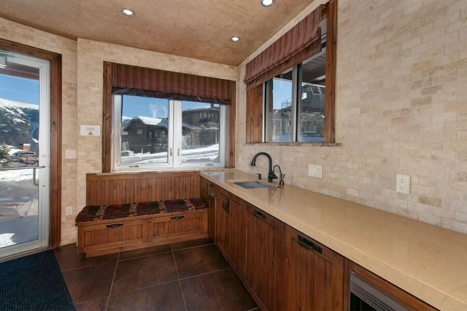 Basement entryway to enter from the ski slopes. Closets for ski/gear storage, mini fridge and dishwasher.