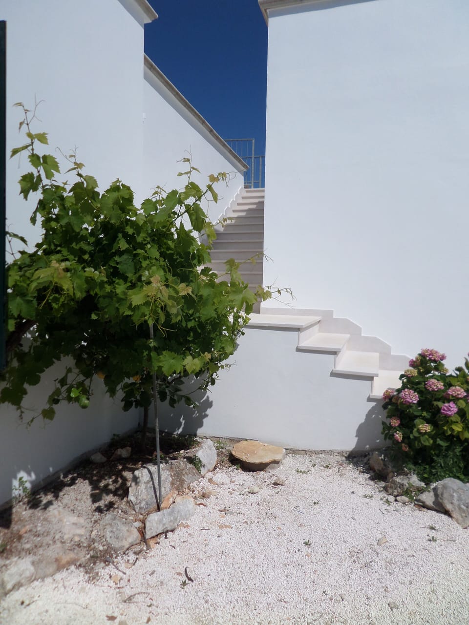 The external stone staircase to the first floor.