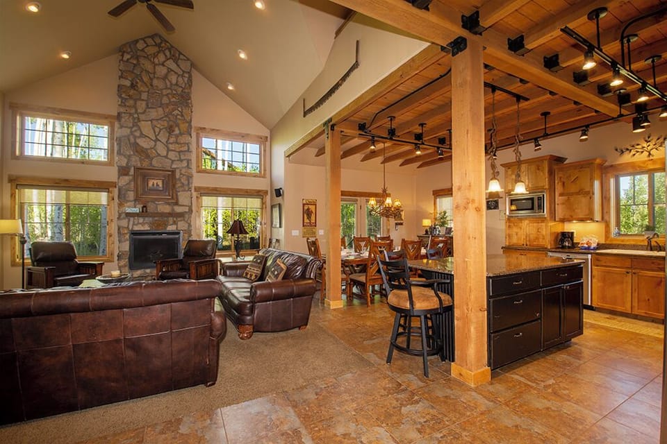 Unwind in this stunning open-concept retreat where rustic beams meet modern comfort. Your gourmet kitchen flows into cozy living spaces.