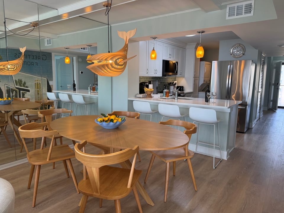 Dining room table for 6 plus island seating for 3 - total of 9. 