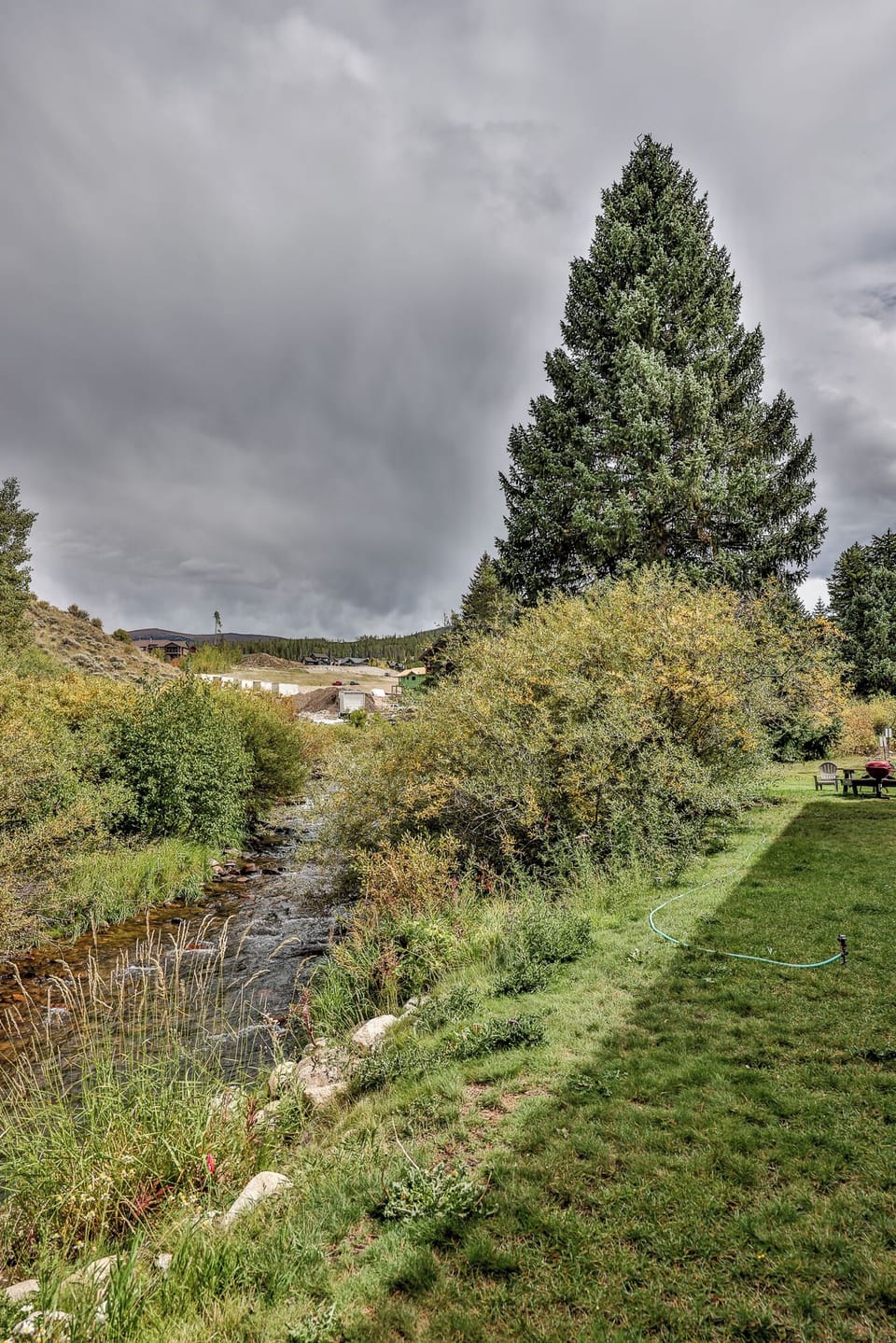 A peaceful riverside location with lush gardens and rolling hills creating a serene countryside setting for your getaway.