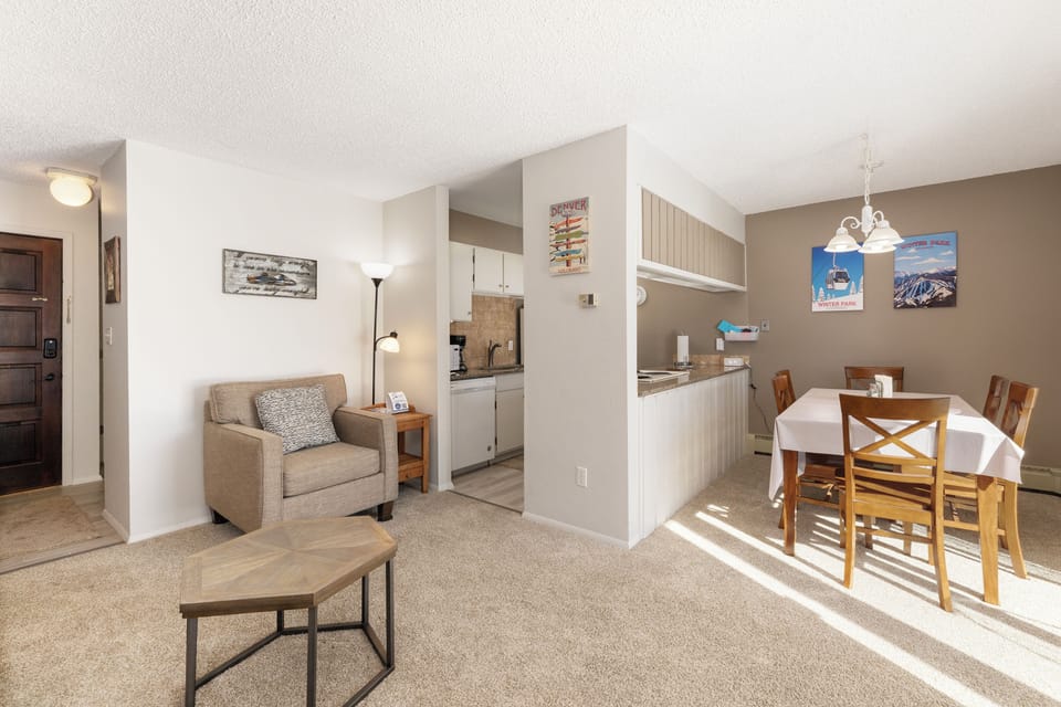 Your bright, open-concept suite seamlessly blends cozy living and dining spaces with a fully equipped kitchen for memorable mountain getaways.