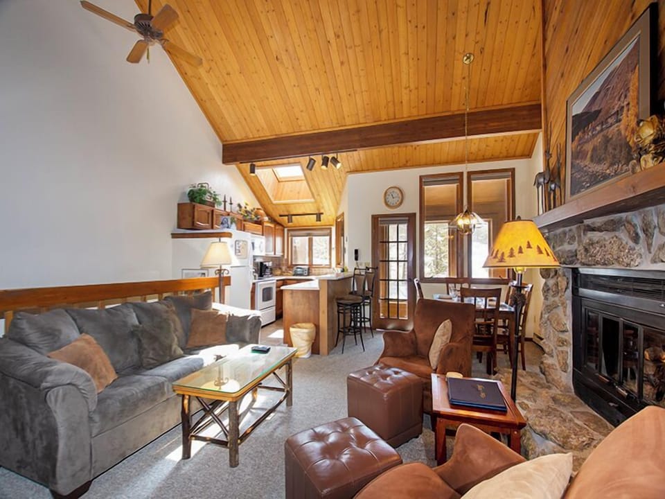Relax in this cozy mountain retreat with soaring wood ceilings, stone fireplace, and open living space perfect for unwinding after adventures.