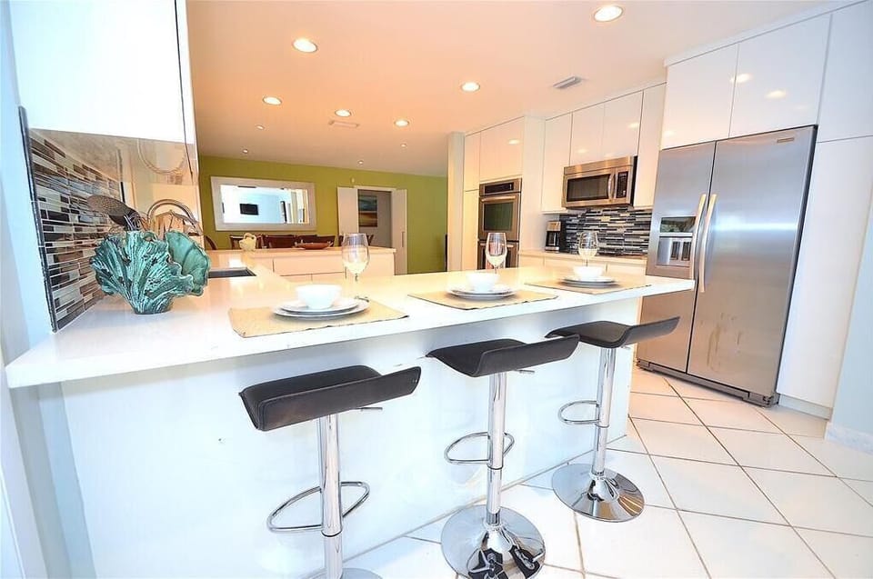 Spectacular Remodeled Kitchen (Fully Equipped) Offers Counter Dining For Six (6) + Direct Pool & Lounge Views...