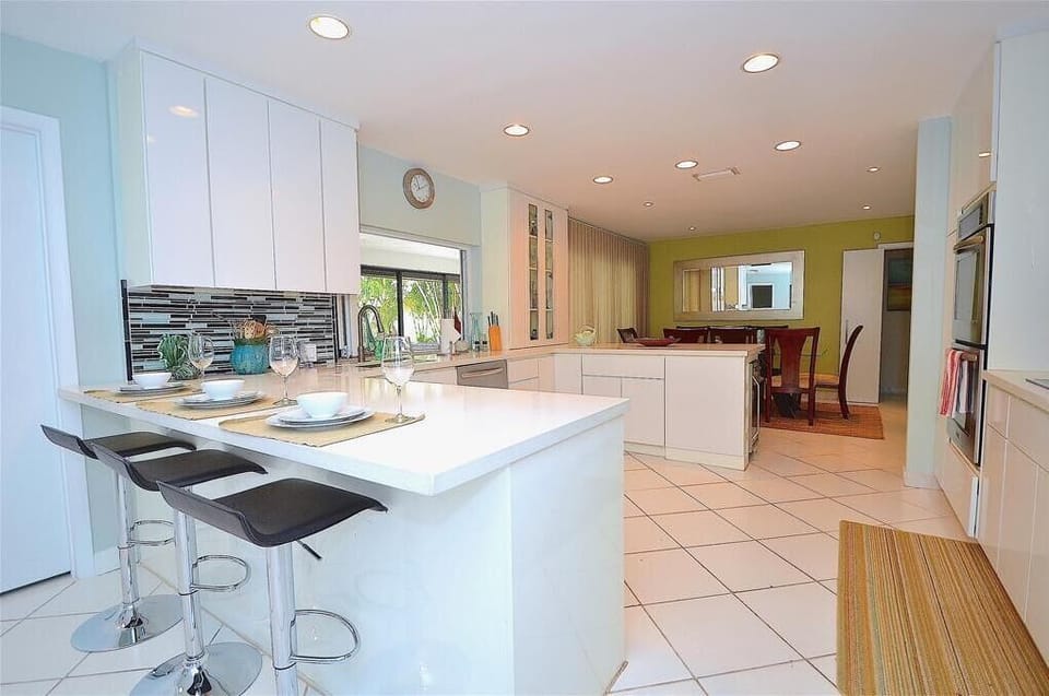 Spectacular Remodeled Kitchen (Fully Equipped) Offers Counter Dining For Six (6) + Formal Dining For Eight (8) + Breakfast Dining For Four (4) + Direct Pool & Lounge Access & Views...