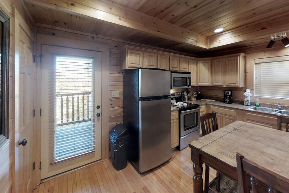 The kitchen is equipped with a basic set of dishes for preparing meals. It is also equipped with a standard 12 cup coffee maker!