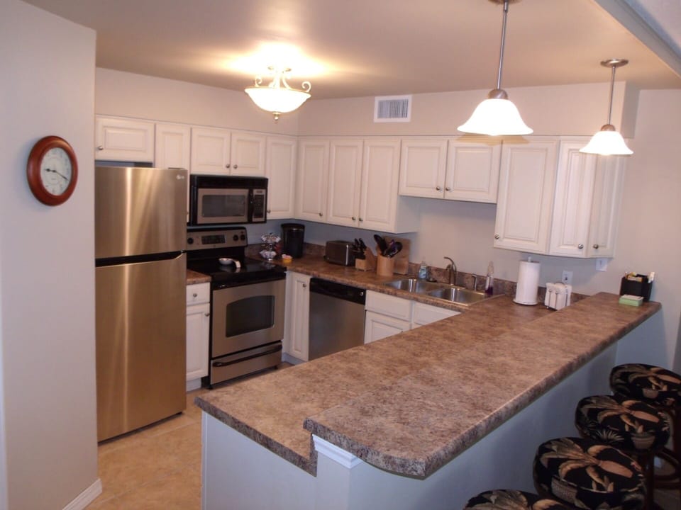 Kitchen with extra seating at bar.